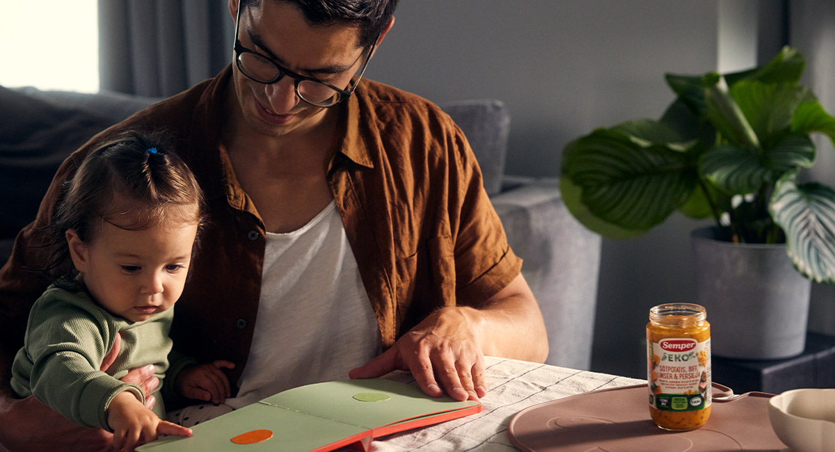 Banner baby and father reading
