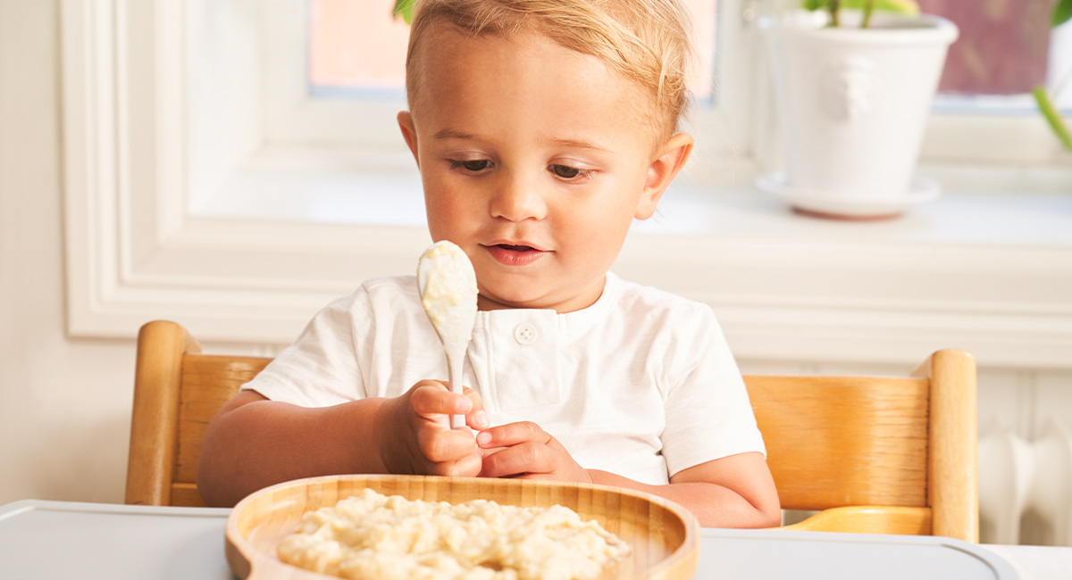 Baby eating porridge