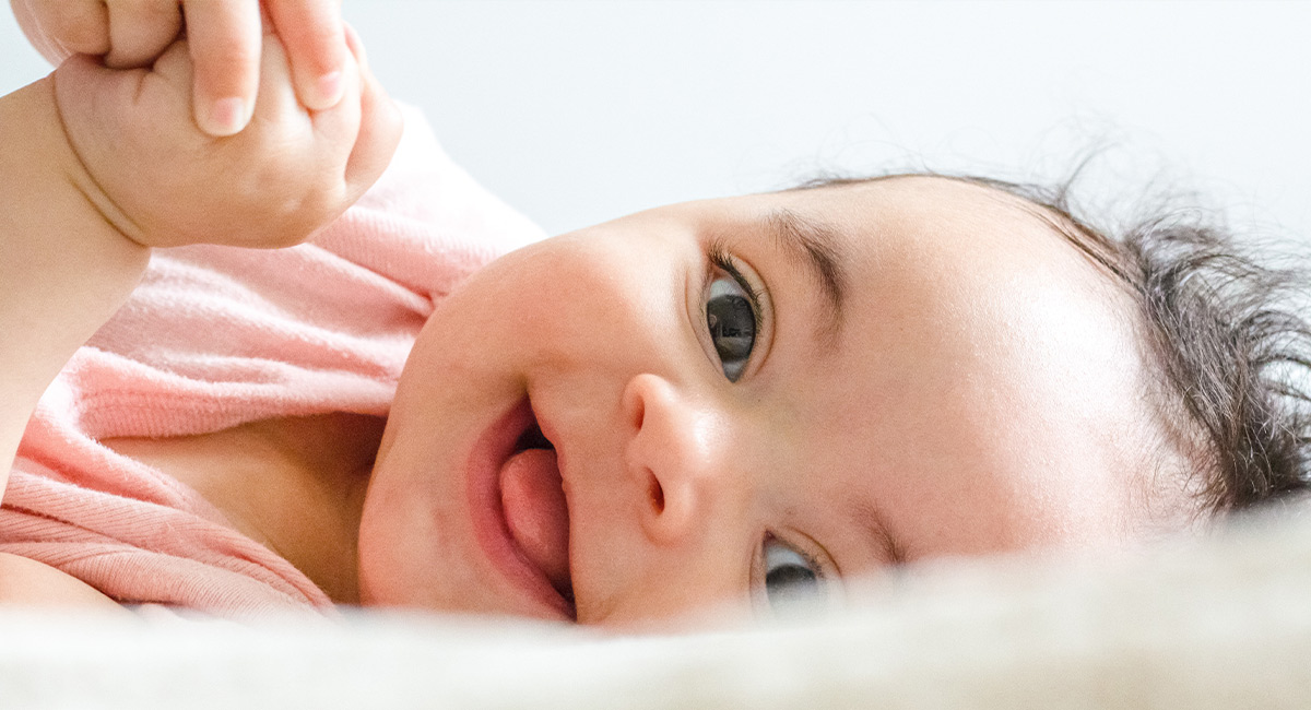 Banner happy baby on bed
