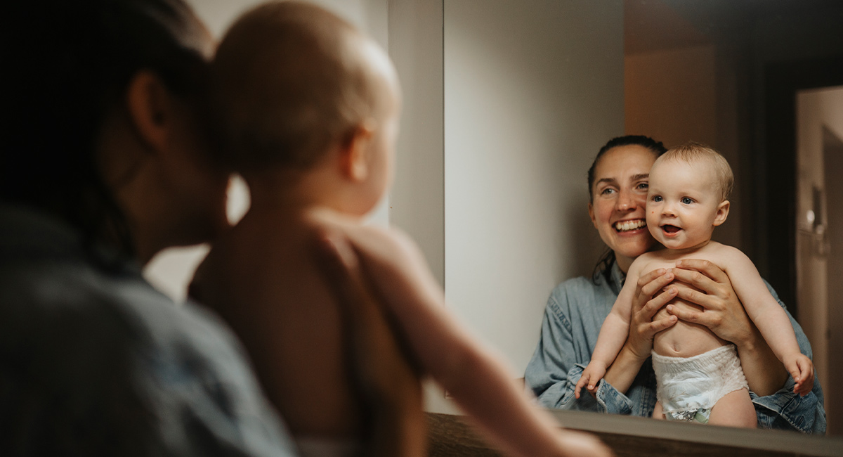 Banner mom and baby in mirror