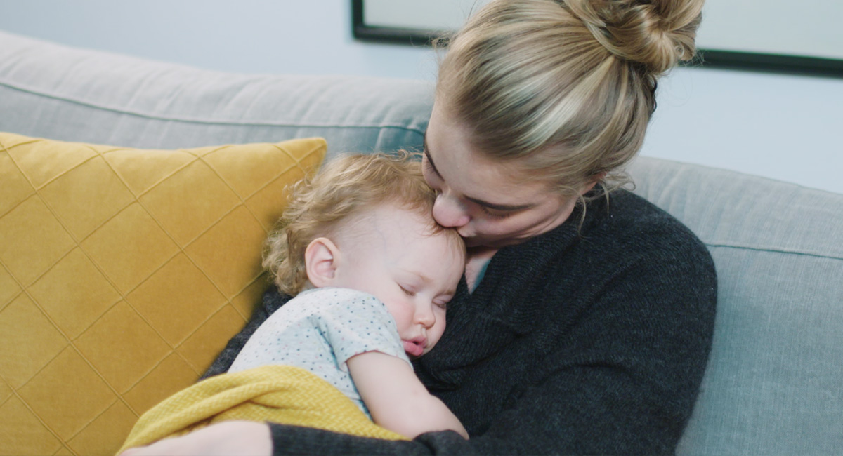 Banner mother and sleeping baby