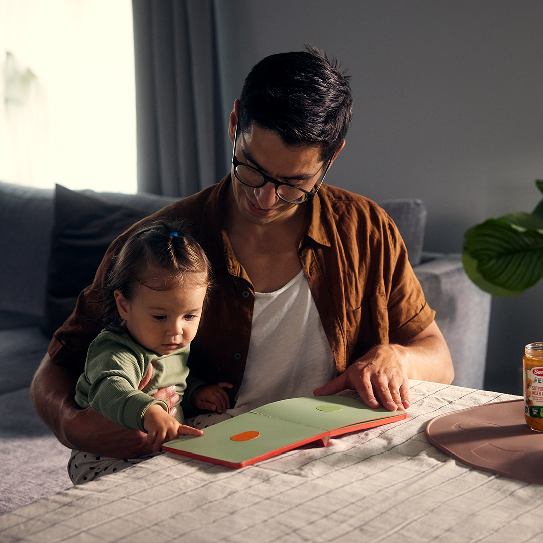 Father reading to his child