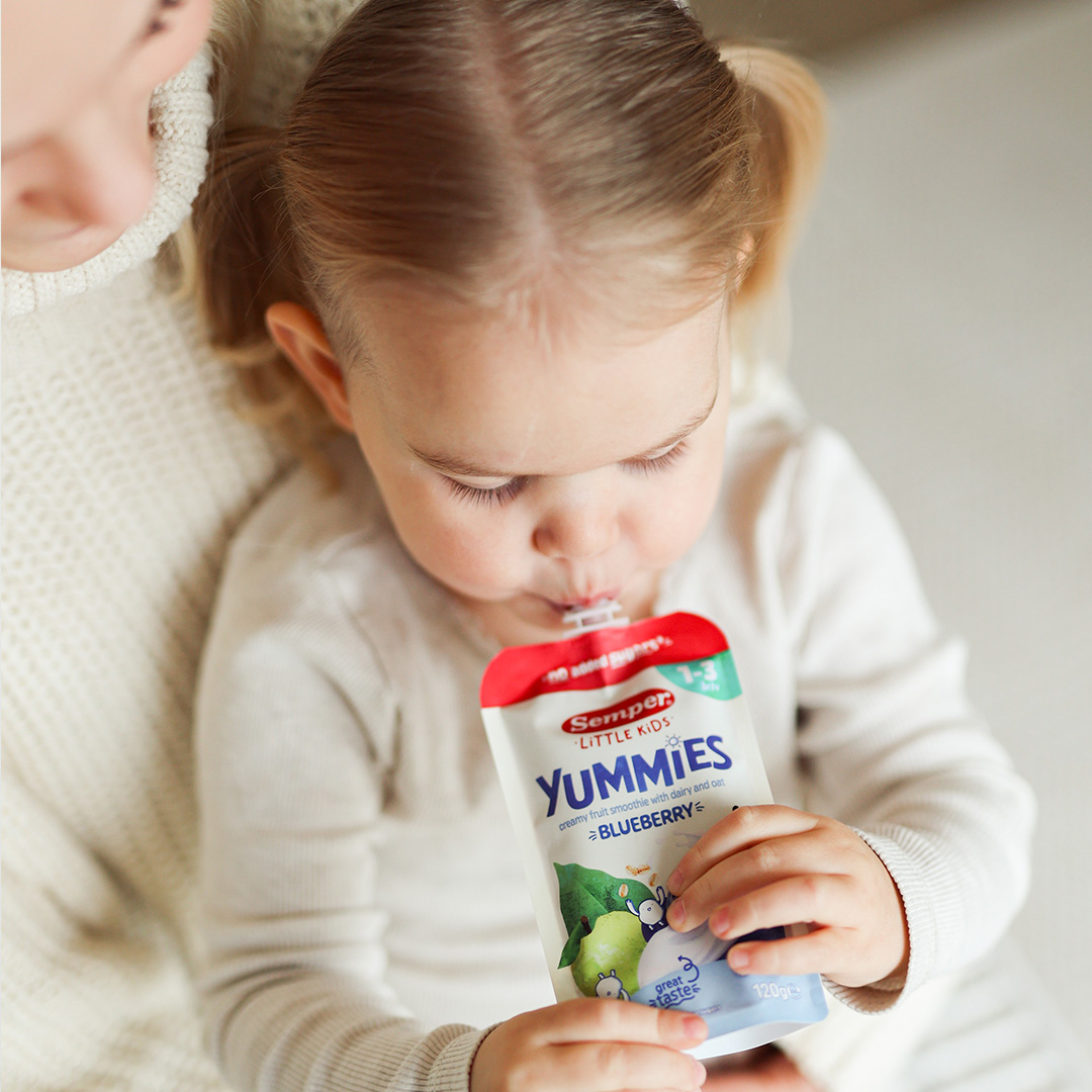 Girl eating Yummies Blueberry