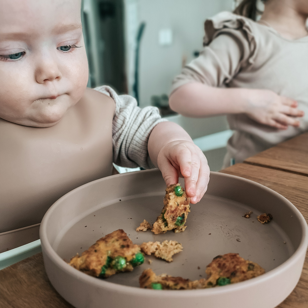Baby eating with hands