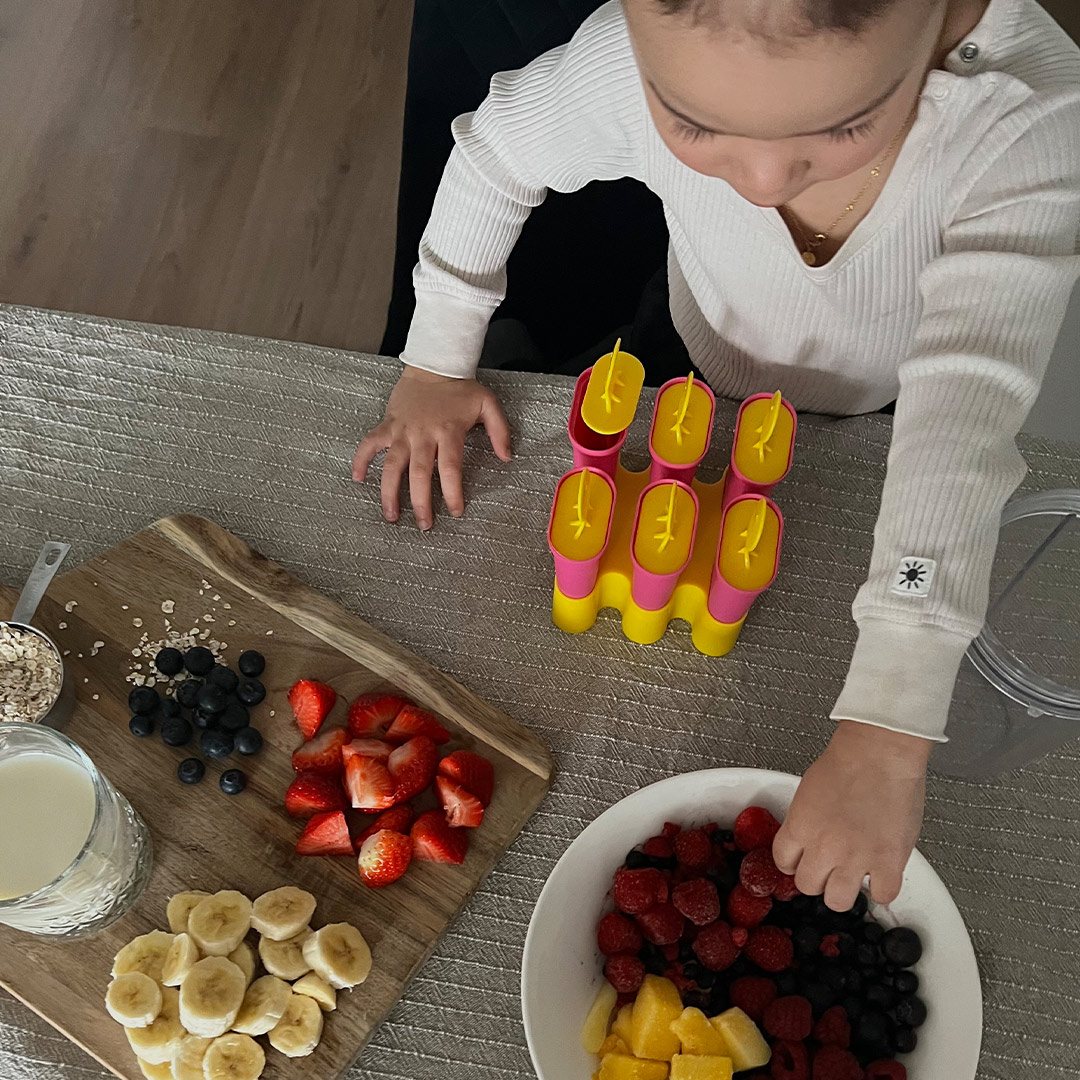 Kid making ice lollies