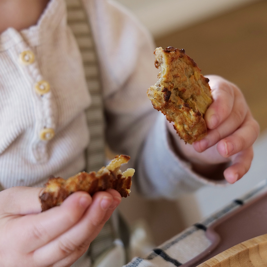 Child holding porridge sticks
